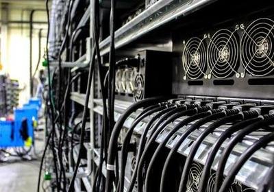 Bitcoin mining farm with rows of mining rigs operating efficiently