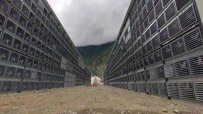 Expansive mining farm with rows of Bitcoin mining machines